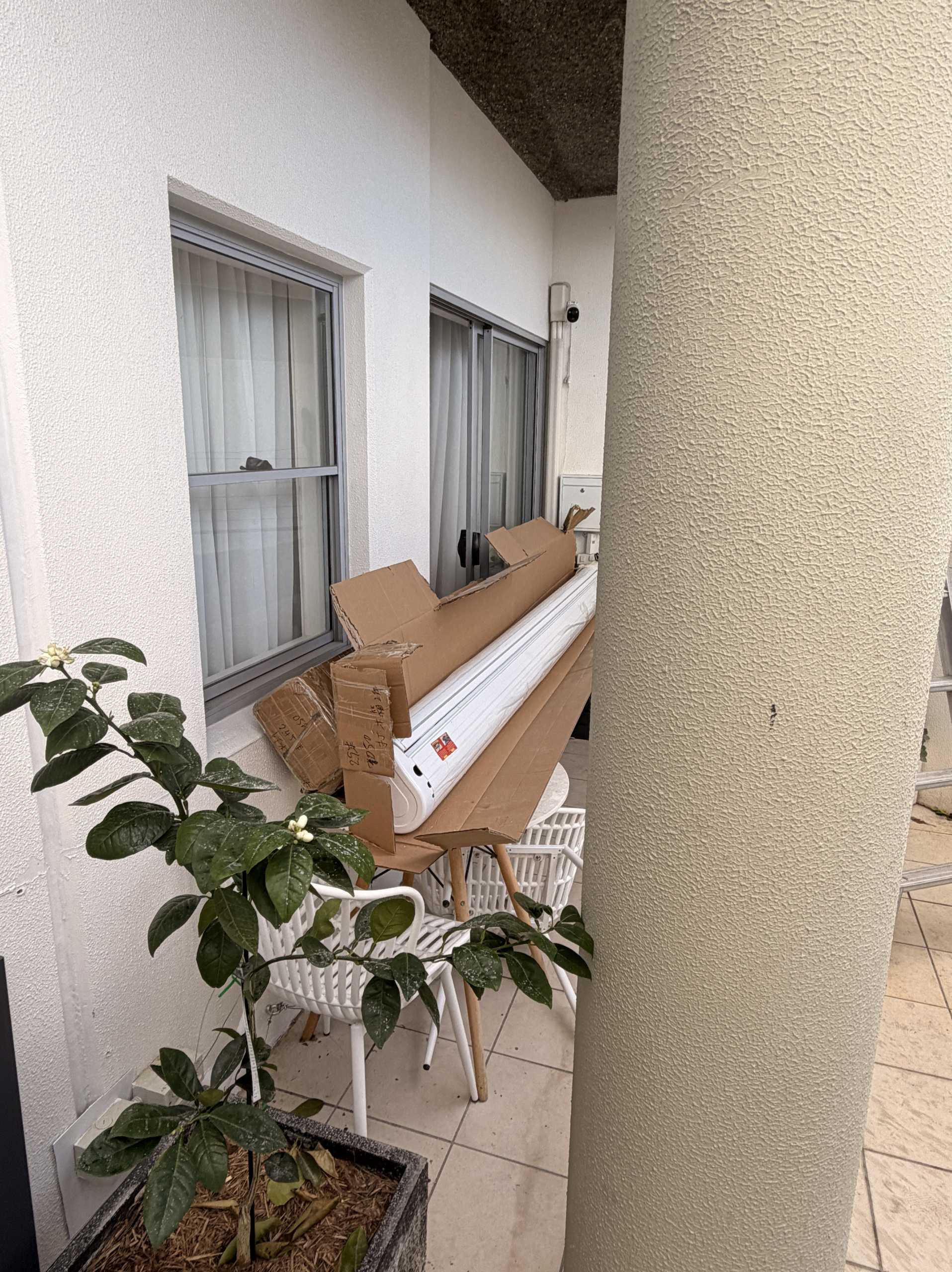 Electric awning bar unpacked before installation